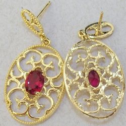 brinco de estamparia banho dourado gota 40x18mm com pedra navete vermelha. 1 par